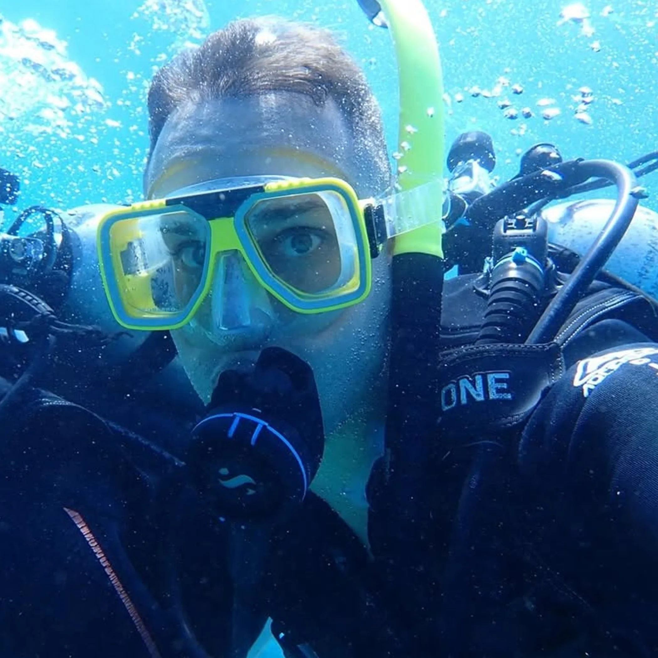 diver underwater near coral reef