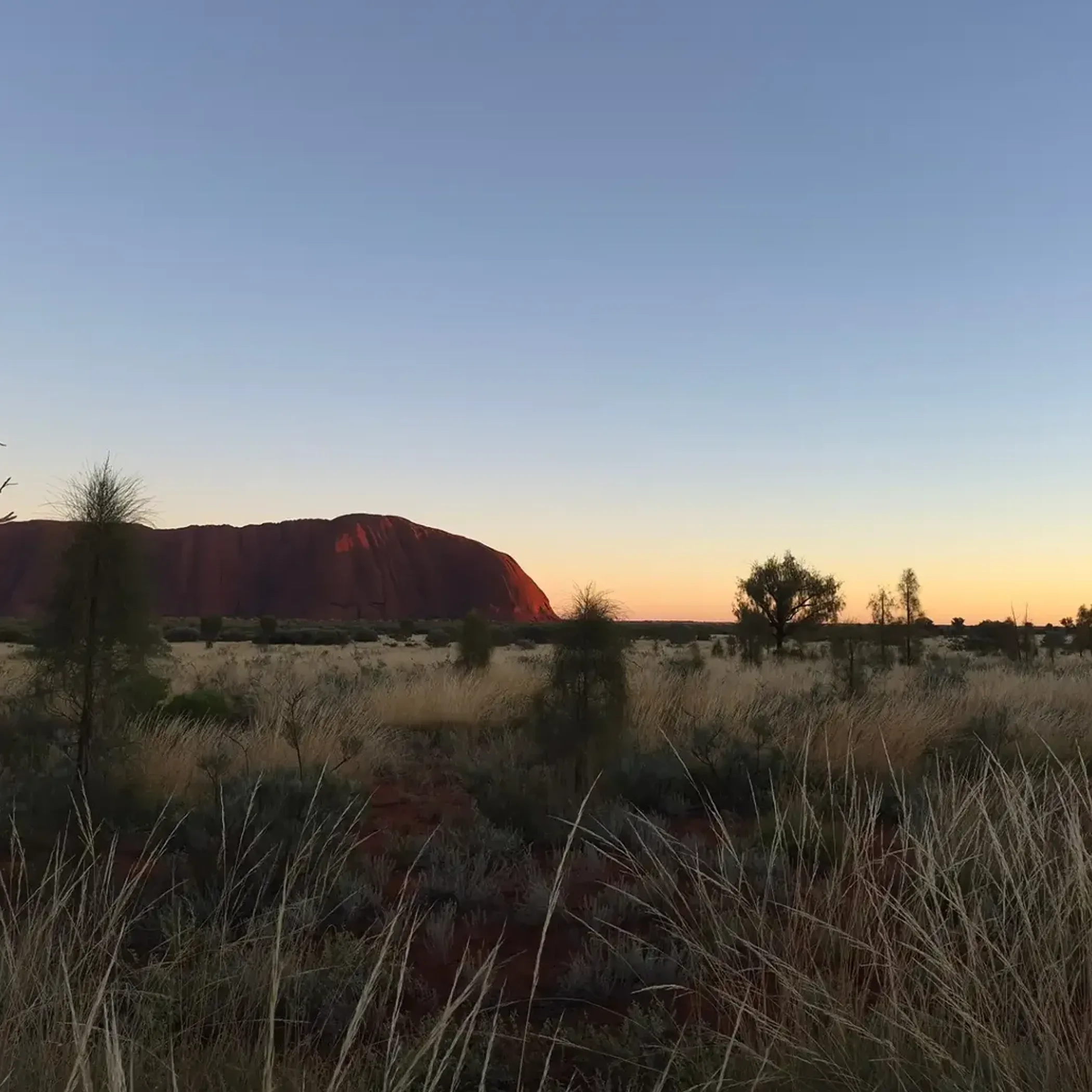 uluru at sunrise clear sky
